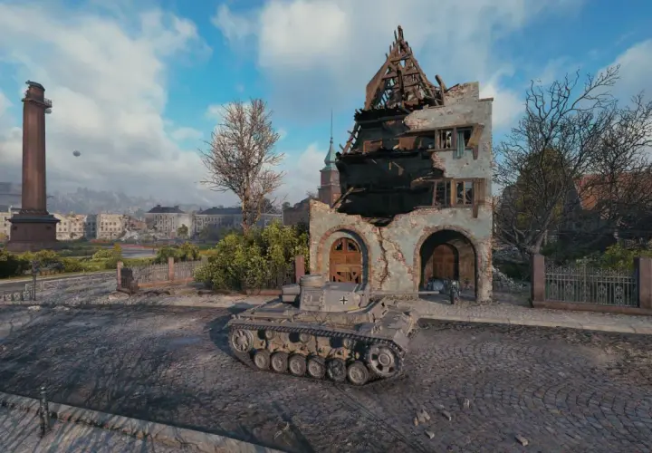 Ein Panzer III J steht vor einer zerstörten Ruine in einer Stadt.