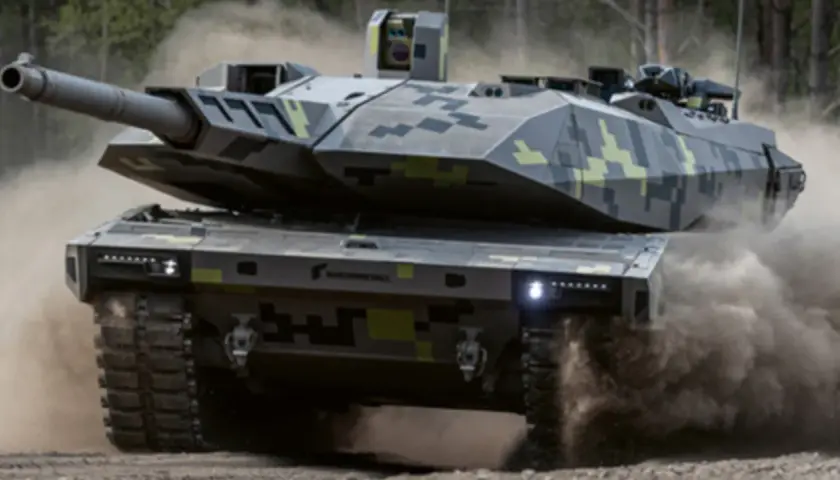 Der KF51 Panther, ein moderner Kampfpanzer der Bundeswehr, fährt durch Staub.