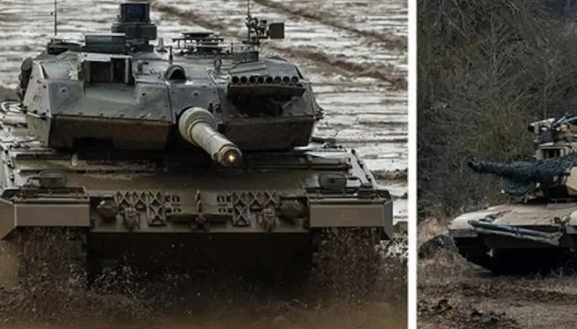 Leopard 2 kämpft sich durch Schlamm, während ein M1 Abrams im Wald lauert.