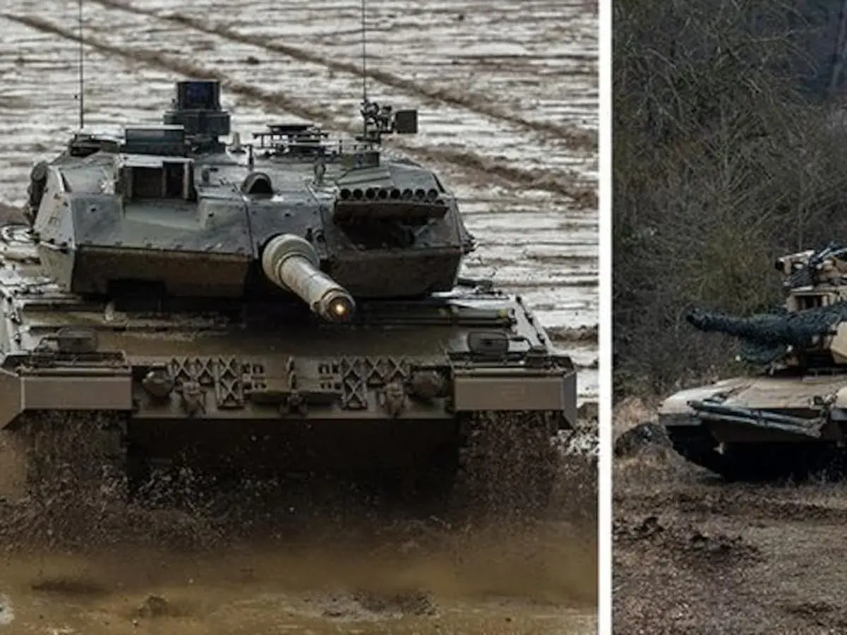 Leopard 2 kämpft sich durch Schlamm, während ein M1 Abrams im Wald lauert.